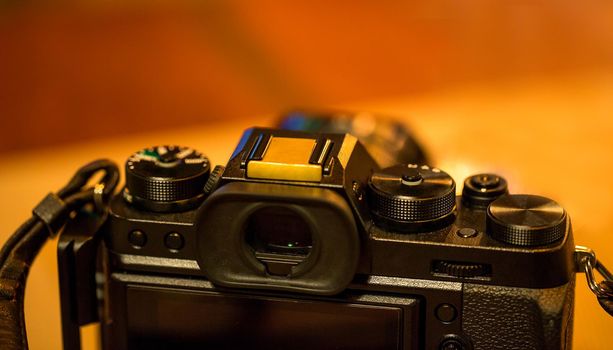 Camera on wooden table in restaurant