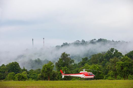 A helicopter is parked in an emergency in a national park.