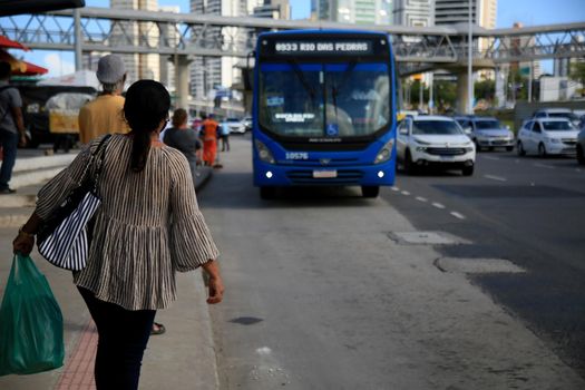 salvador, bahia, brazil - july 20, 2021: passengers are seen waiting for public transport buses at a bus stop in the city of Salvador.