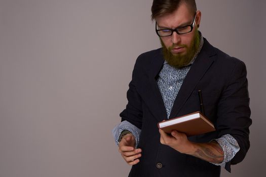 portrait of a business man wearing glasses with a beard posing an official. High quality photo