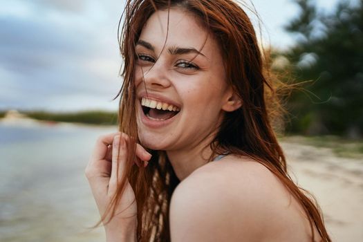 woman in blue swimsuit on the beach island lifestyle. High quality photo