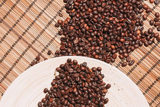 coffee beans Hot drink spilled grains view from above. High quality photo