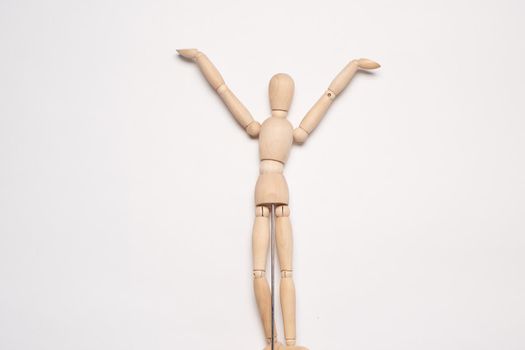 wooden mannequin object light background posing. High quality photo