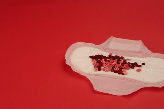 feminine pad blood menstruation hygiene red background. High quality photo