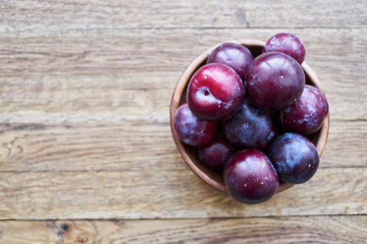 plums fruits natural products on a wooden table top view. High quality photo