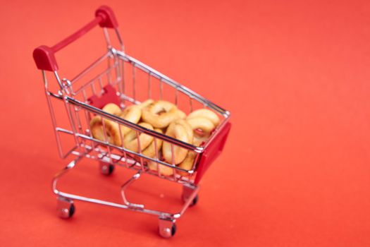 grocery cart red background supermarket isolated background. High quality photo