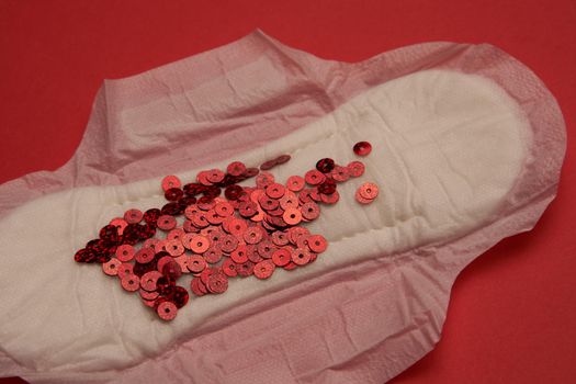 feminine pad blood menstruation hygiene red background. High quality photo