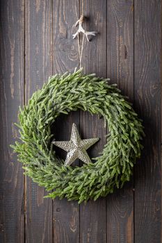 Close up of a Christmas wreath with a decor.