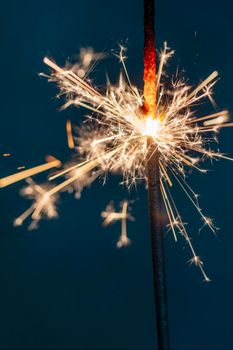 Christmas sparkler lights on black background.