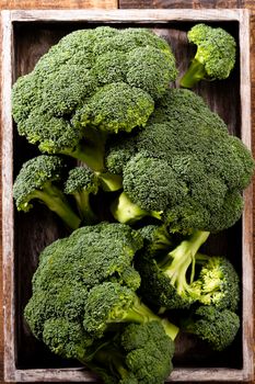 Broccoli. Fresh green broccoli on a blau stone table. Top view. Free copy space.