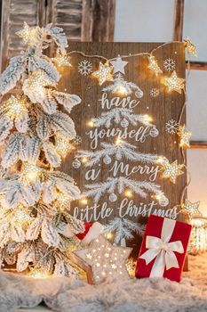 Board with Merry Christmas message on wooden background.