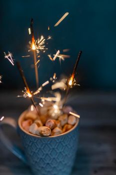 Christmas sparkler lights on black background.