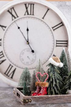 New Year's clock. Decorated with christmas tree decorations background. Celebration Concept for New Year Eve.