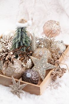 Golden christmas cozy balls with wool background.