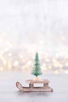 Christmas tree on silver, bokeh background.