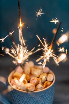 Christmas sparkler lights on black background.