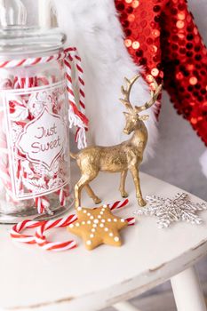 Christmas Santa Claus Hat Hanging On Wood chair, Xmas Concept, Decoration Over Grunge Wooden Background.