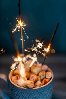 Christmas sparkler lights on black background.