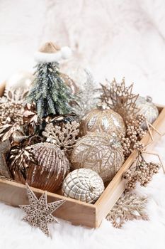 Golden christmas cozy balls with wool background.