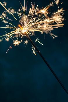 Christmas sparkler lights on black background.