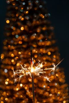 Christmas sparkler lights on black background.