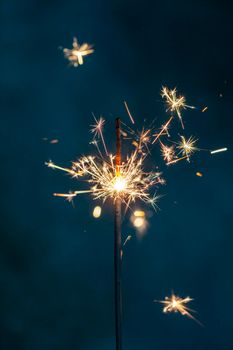 Christmas sparkler lights on black background.