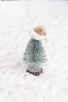 Christmas little trees and wool background.