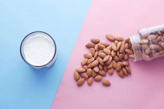 almond nut and milk on table top down.