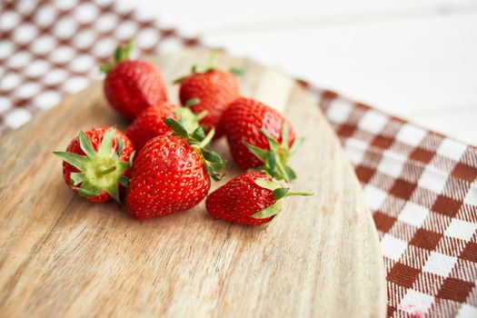 fresh strawberries on wooden board fruit vitamins summer. High quality photo