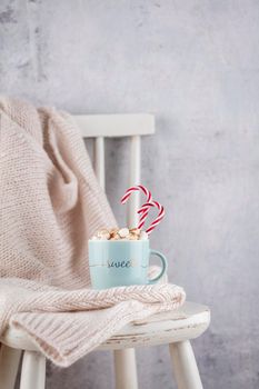 Cozy christmas composition with a cup and cookies. Hot chocolate with marshmallow.