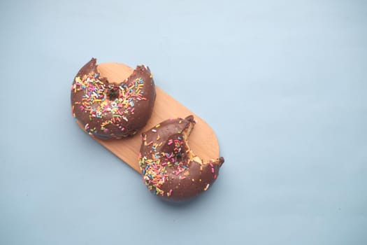 chocolate donuts on plate with copy space.