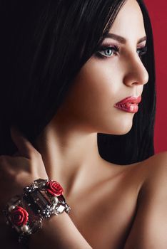 portrait of a brunette girl with red lips and blue eyes