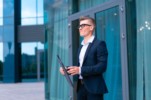 Business. Businessman Glasses With Folder Standing Office Building Entrance Handsome Caucasian Male Business Person Portrait City Corporative Building Background Successful Young Adult Manager