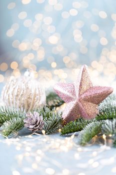 Christmas spruce with star and blurred shiny lights.