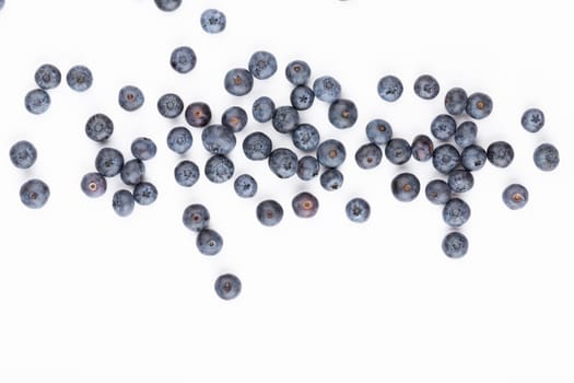 Blueberries isolated on white background. Blueberry border design. Ripe and juicy fresh picked bilberries close up. 