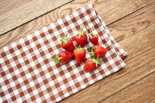 fresh strawberry summer fruit vitamins dessert checkered tablecloth. High quality photo