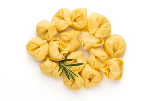 Homemade pasta,  raw tortellini with herbs.