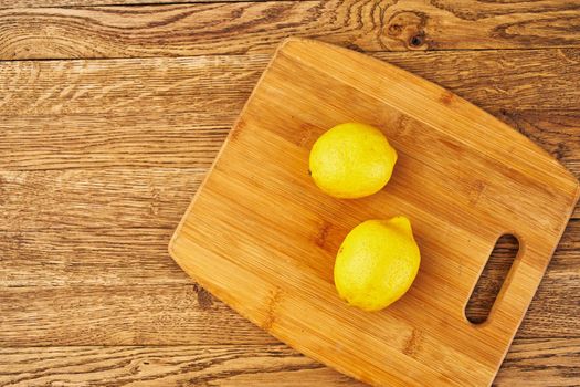 yellow lemon cutting board kitchen fresh food. High quality photo