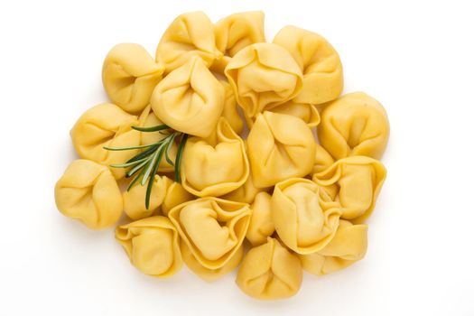 Raw homemade pasta,tortellini with herbs.