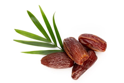 Dry dates isolated on white background. Top view. Flat lay pattern.