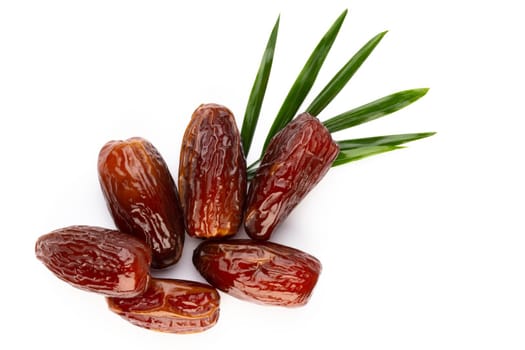 Dry dates isolated on white background. Top view. Flat lay pattern.