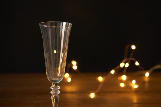 christmas decoration champagne glasses garland holiday wooden table. High quality photo