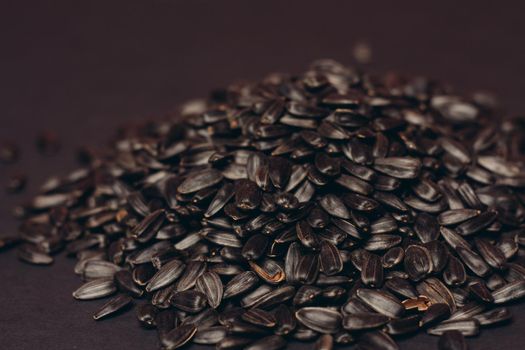 natural product sunflower seeds handing close-up food. High quality photo