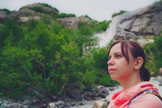 Adult female tourist enjoying beautiful view in mountainous area.