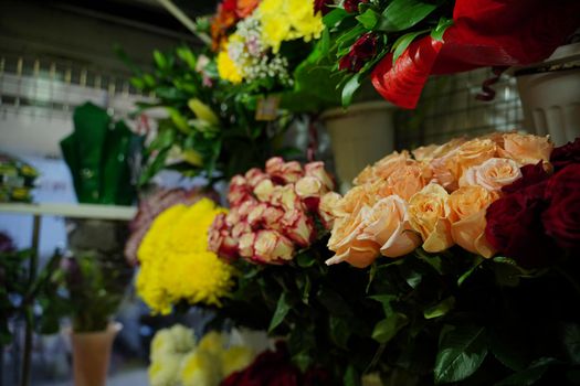 Bouquets of various flowers on counter. Fresh beautiful flowers in florist shop