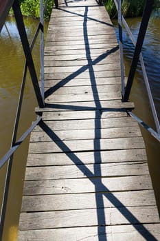 wooden bridge on the river, photo close-up with details of the construction, closeup