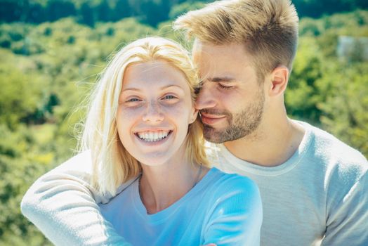 Romantic portrait of a sensual couple in love. Enjoying tender warm pleasant moment of love. Romantic couple caressing in bed