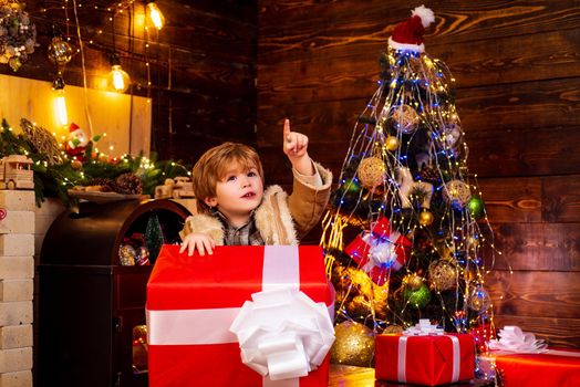 Christmas kids. Models child having fun with gift. The morning before Christmas. Cute little kids celebrating Christmas