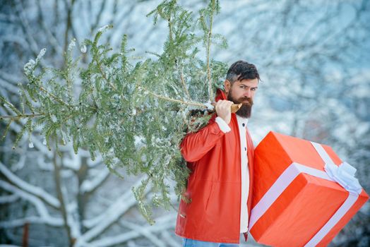 Merry Christmas and Happy new year. Man is happy about the new year. Hipster Santa Claus. Christmas Man on white snow background