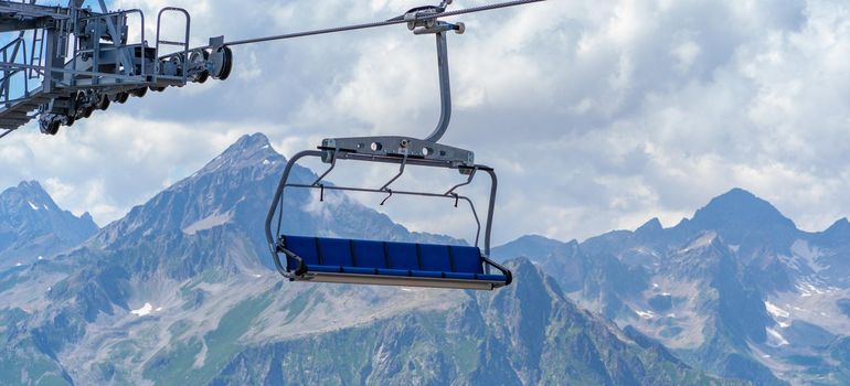 Modern ropeway with benches in amazing mountainous terrain.